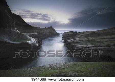 The Rugged Coastline Of The Pacific Ocean; Pacific City Oregon United States Of America View Large Photo Image Stock Photo - The Rugged Coastline Of The Pacific Ocean; Pacific City Oregon United States Of America. Fotosearch