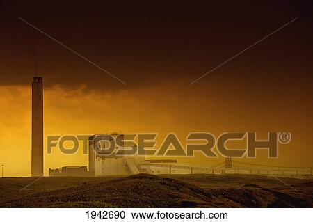 The Sky Glows At Sunset Over A Building; Northumberland England View Large Photo Image Stock Image - The Sky Glows At Sunset Over A Building; Northumberland England. Fotosearch