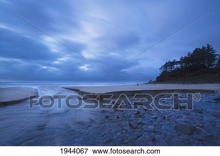 Stock Photo - Tide Coming Up On The Rocks Along The Coast; Oregon United States Of America. Fotosearch