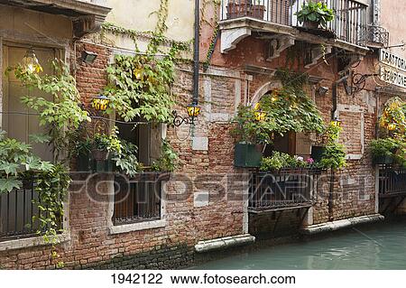 Stock Image - Trattoria On The Canal; Venice Italy. Fotosearch
