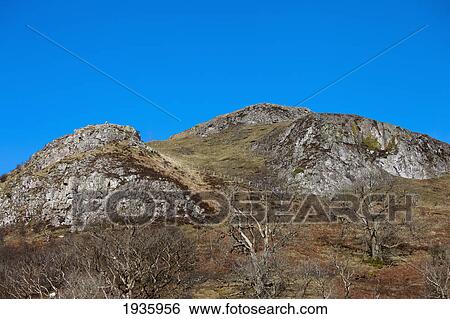 Two Hills Against A Blue Sky; Northumberland, England View Large Photo Image Stock Photograph - Two Hills Against A Blue Sky; Northumberland, England. Fotosearch