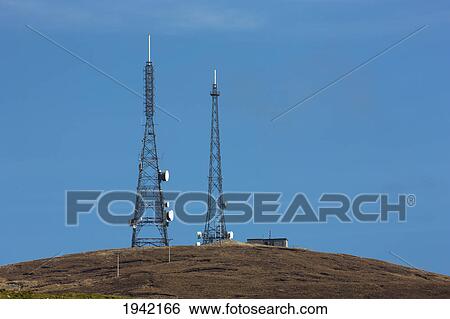 Two Transmission Towers Against A Blue Sky; Shetland Scotland View Large Photo Image Stock Photograph - Two Transmission Towers Against A Blue Sky; Shetland Scotland. Fotosearch