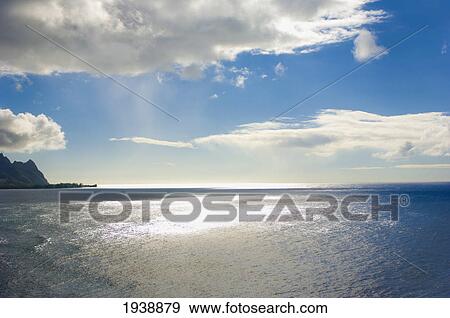 View Of Ocean And Clouds Above With The Sunlight Shining Through; Hawaii United States Of America View Large Photo Image Stock Photo - View Of Ocean And Clouds Above With The Sunlight Shining Through; Hawaii United States Of America. Fotosearch