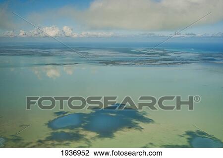 Stock Image - View Of The Ocean And Clouds In The Sky; South Caicos Turks And Caicos Islands. Fotosearch