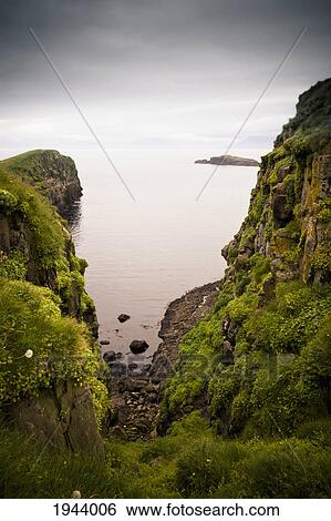 Stock Photograph - View Of The Ocean From A Rocky Shoreline; Papey Island Iceland. Fotosearch