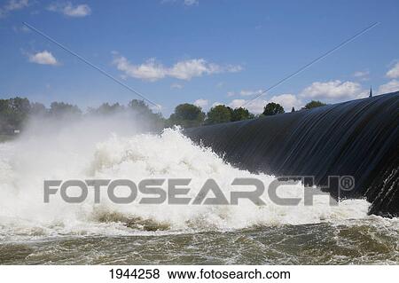 water flowing over a ledge and crashing into the richelieu river; chambly quebec canada View Large Photo Image Stock Photo - water flowing over a ledge and crashing into the richelieu river; chambly quebec canada. Fotosearch