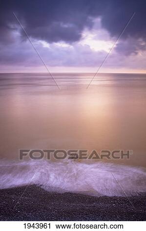 Water Lapping Onto The Shore At Sunset; Camogli Liguria Italy View Large Photo Image Stock Image - Water Lapping Onto The Shore At Sunset; Camogli Liguria Italy. Fotosearch