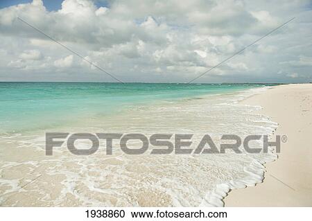 Water Washing Up Onto The Sandy Beach; Providenciales Turks And Caicos Islands View Large Photo Image Stock Image - Water Washing Up Onto The Sandy Beach; Providenciales Turks And Caicos Islands. Fotosearch