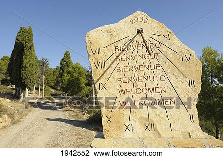 Welcome Sun Dial In Six Languages; Valdealgorfa Teruel Aragon Spain View Large Photo Image Stock Image - Welcome Sun Dial In Six Languages; Valdealgorfa Teruel Aragon Spain. Fotosearch