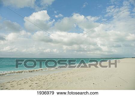 Stock Photo - White Sand Along A Blue Green Ocean; South Caicos Turks And Caicos Islands. Fotosearch
