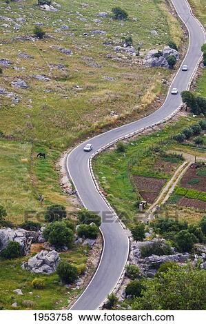 Stock Photo - winding road leading into grazalema; cadiz andalusia spain. Fotosearch