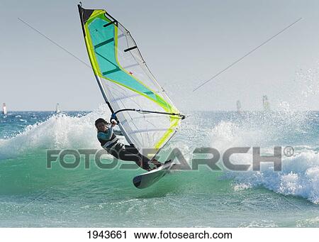 Stock Image - Windsurfing Off Punta Paloma; Tarifa Cadiz Andalusia Spain. Fotosearch