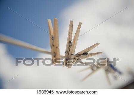 Woden Pegs On A Clothesline; South Caicos Turks And Caicos Islands View Large Photo Image Stock Photography - Woden Pegs On A Clothesline; South Caicos Turks And Caicos Islands. Fotosearch