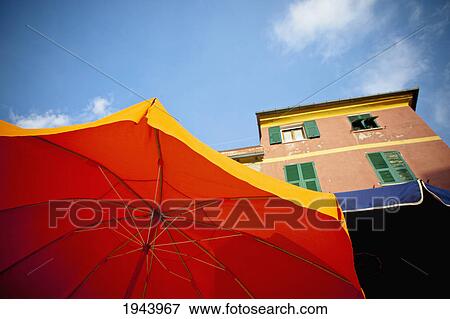Yellow And Bbue Patio Umbrellas Below A Building; Vernazza Liguria Italy View Large Photo Image Stock Photo - Yellow And Bbue Patio Umbrellas Below A Building; Vernazza Liguria Italy. Fotosearch