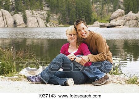Stock Image - Young Couple By Sylvan Lake; Black Hills South Dakota Usa. Fotosearch