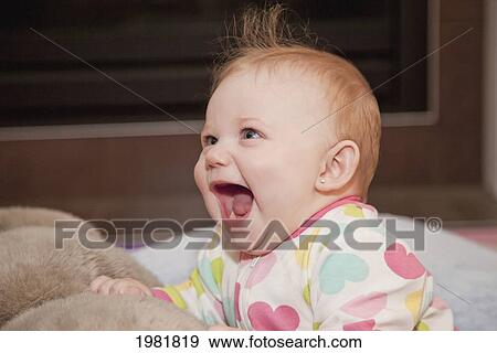 a baby girl laughing; spruce grove alberta canada View Large Photo Image Stock Photo - a baby girl laughing; spruce grove alberta canada. Fotosearch