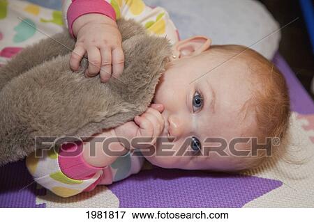 a baby girl sucking her thumb; spruce grove alberta canada View Large Photo Image Stock Photo - a baby girl sucking her thumb; spruce grove alberta canada. Fotosearch