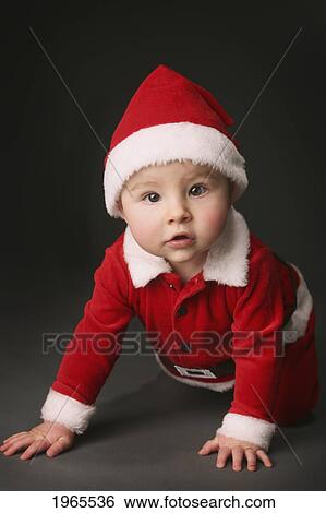 a baby wearing a santa claus costume; edmonton alberta canada View Large Photo Image Stock Photograph - a baby wearing a santa claus costume; edmonton alberta canada. Fotosearch