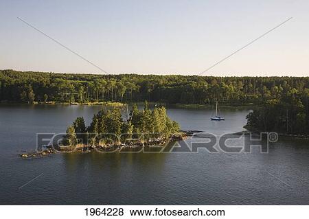 Stock Photo - a boat in approach in the waterway; stockholm, sweden. Fotosearch