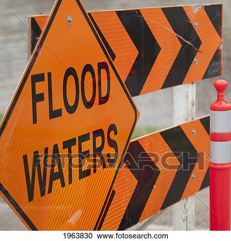 a construction barricade saying flood waters; newton, manitoba, canada View Large Photo Image Stock Image - a construction barricade saying flood waters; newton, manitoba, canada. Fotosearch