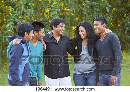 Stock Image - a family enjoying time together in a park; edmonton alberta canada. Fotosearch