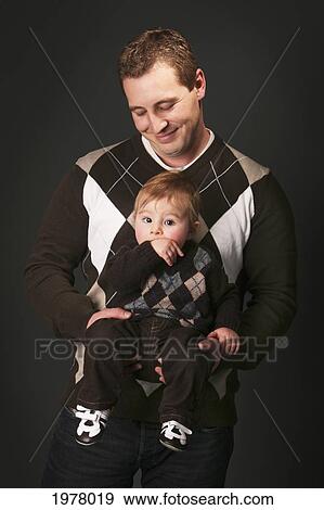 Stock Photo - a father and son wearing matching outfits; edmonton alberta canada. Fotosearch