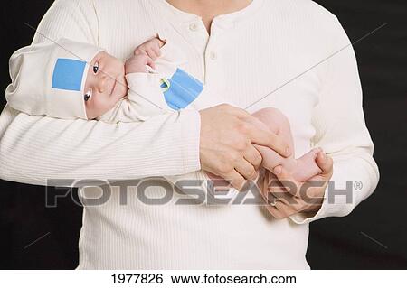 a father holds a newborn baby; edmonton alberta canada View Large Photo Image Stock Photograph - a father holds a newborn baby; edmonton alberta canada. Fotosearch