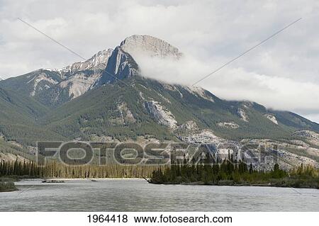 a lake and the rocky mountains; jasper, alberta, canada View Large Photo Image Stock Photo - a lake and the rocky mountains; jasper, alberta, canada. Fotosearch