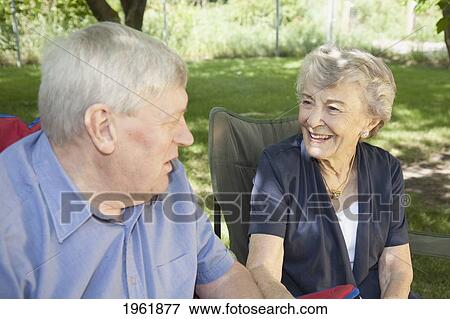 a man and a woman sit talking; edmonton, alberta, canada View Large Photo Image Stock Photo - a man and a woman sit talking; edmonton, alberta, canada. Fotosearch