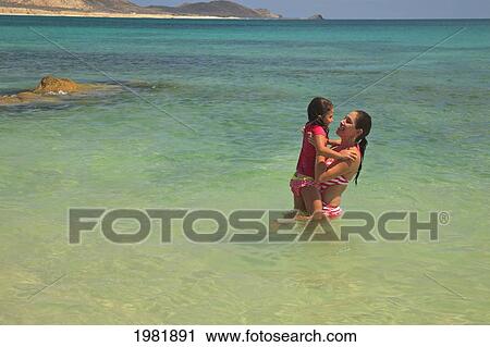a mother and daughter in the water together at cabo pulmo; baja california sur mexico View Large Photo Image Stock Image - a mother and daughter in the water together at cabo pulmo; baja california sur mexico. Fotosearch