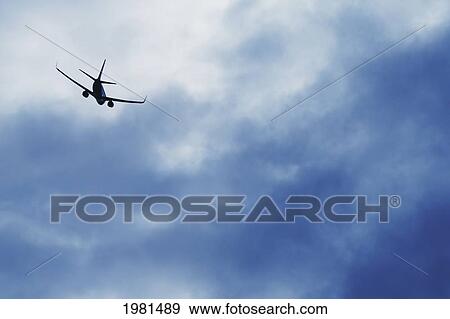 Stock Photo - a plane in the sky; alberta canada. Fotosearch
