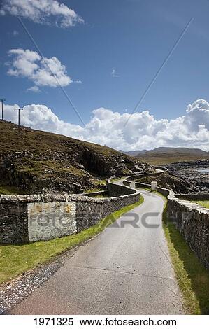 a road with a stone wall on either side curving along the coast; ardnamurchan argyl scotland View Large Photo Image Stock Photography - a road with a stone wall on either side curving along the coast; ardnamurchan argyl scotland. Fotosearch