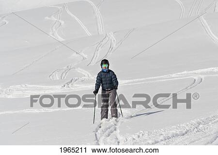 a skier making their way down a hill; whistler british columbia canada View Large Photo Image Stock Image - a skier making their way down a hill; whistler british columbia canada. Fotosearch