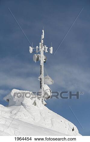 Picture - a transmission tower covered in snow; whistler, british columbia, canada. Fotosearch