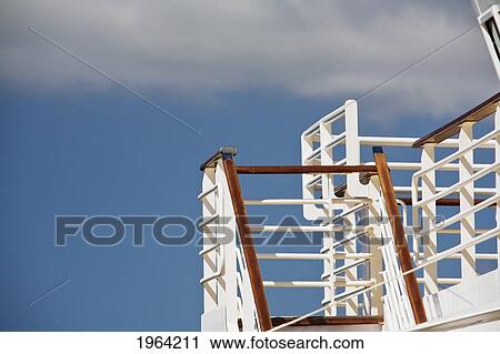 a white railing on a staircase with a blue sky and clouds in the background; bay of biscay, france View Large Photo Image Stock Image - a white railing on a staircase with a blue sky and clouds in the background; bay of biscay, france. Fotosearch