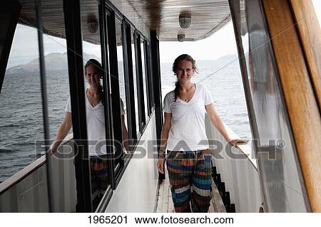 a young woman on the deck of a boat; galapagos equador View Large Photo Image Stock Image - a young woman on the deck of a boat; galapagos equador. Fotosearch