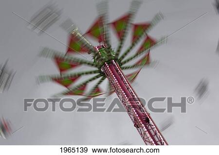 amusement ride in the evening with lights and motion; portland oregon united states of america View Large Photo Image Stock Photo - amusement ride in the evening with lights and motion; portland oregon united states of america. Fotosearch