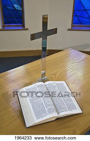 an open bible beside a cross on a table; sheffield, south yorkshire, england View Large Photo Image Stock Image - an open bible beside a cross on a table; sheffield, south yorkshire, england. Fotosearch