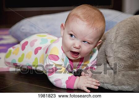 baby girl with a funny facial expression; spruce grove alberta canada View Large Photo Image Stock Image - baby girl with a funny facial expression; spruce grove alberta canada. Fotosearch