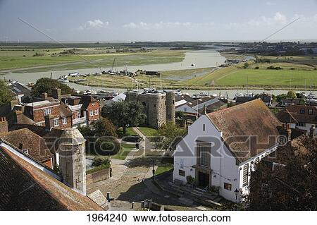 Stock Image - boats in the river rother and buildings along the shoreline; rye, sussex, england. Fotosearch