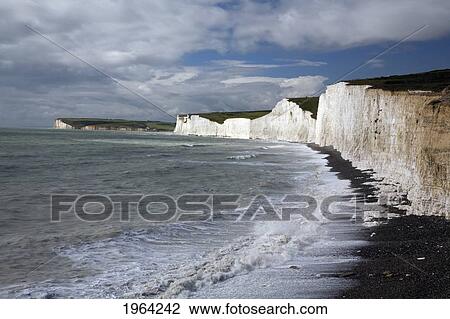 Stock Image - chalk headland cliffs along the coast; south downs, sussex, england. Fotosearch