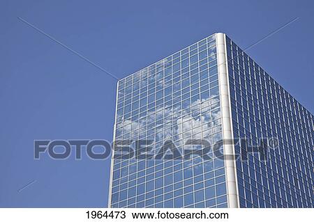 clouds reflected in the windows of a skyscraper against a blue sky; edmonton, alberta, canada View Large Photo Image Stock Image - clouds reflected in the windows of a skyscraper against a blue sky; edmonton, alberta, canada. Fotosearch