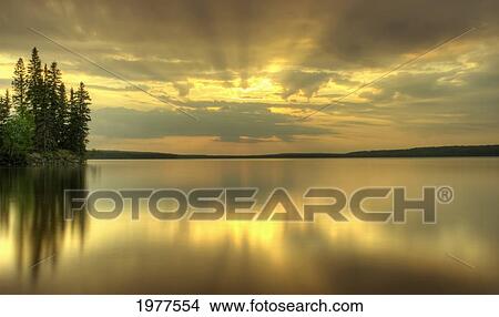 colourful sunrise on waskesiu lake in prince albert national park; saskatchewan canada View Large Photo Image Picture - colourful sunrise on waskesiu lake in prince albert national park; saskatchewan canada. Fotosearch
