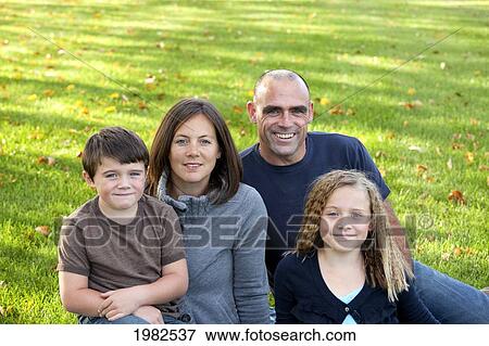 family portrait in a park; beaumont alberta canada View Large Photo Image Stock Photo - family portrait in a park; beaumont alberta canada. Fotosearch
