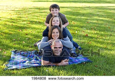 Stock Photo - family totem pole in the park; beaumont alberta canada. Fotosearch