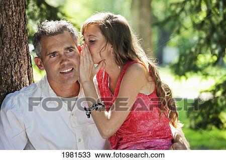 Stock Image - father and daughter spending quality time together in a park; edmonton alberta canada. Fotosearch