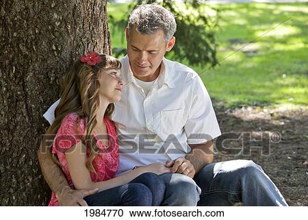 father and daughter spending quality time together in a park; edmonton alberta canada View Large Photo Image Stock Image - father and daughter spending quality time together in a park; edmonton alberta canada. Fotosearch