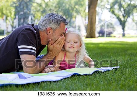 Stock Photograph - father and daughter spending quality time together in the park; edmonton alberta canada. Fotosearch