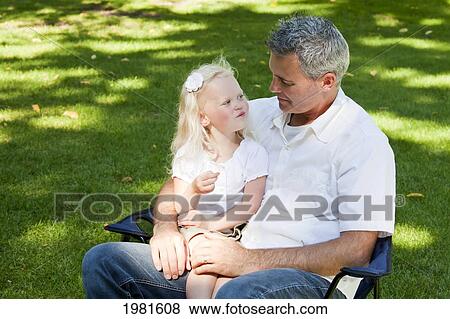 father and toddler spending time together in the park; edmonton alberta canada View Large Photo Image Stock Photo - father and toddler spending time together in the park; edmonton alberta canada. Fotosearch