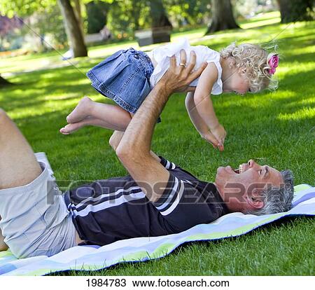 father and young daughter spending quality time together in a park; edmonton alberta canada View Large Photo Image Stock Image - father and young daughter spending quality time together in a park; edmonton alberta canada. Fotosearch